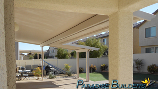 Solid patio cover with custom bumpout for more shade in the backyard